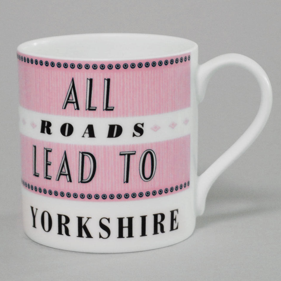 white and pink bone china mug text says all roads lead to yorkshire