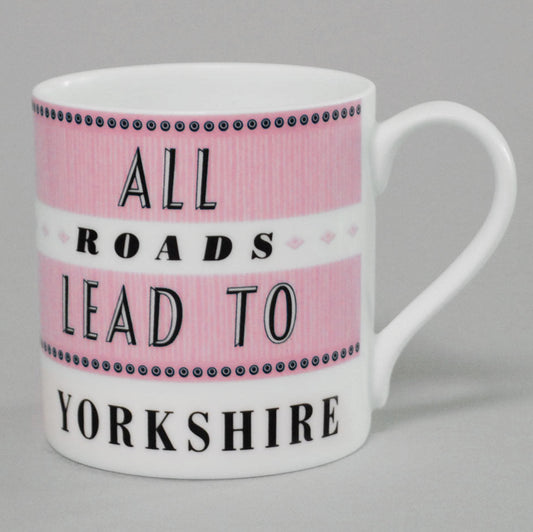 white and pink bone china mug text says all roads lead to yorkshire