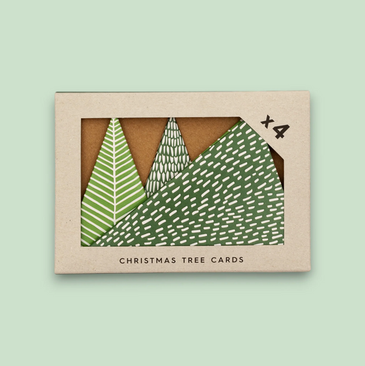 Box of Christmas tree cards with green and white designs on a light green background