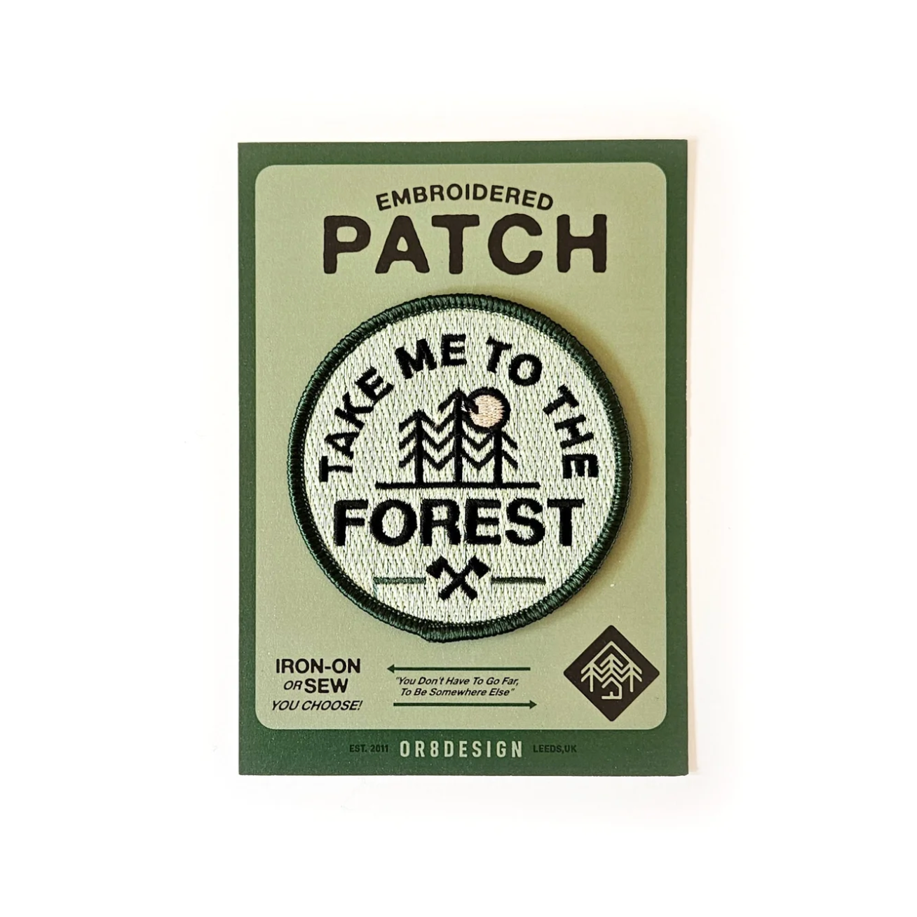 Embroidered patch with 'Take Me to the Forest' design on a green card