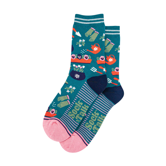 Colorful socks with garden-themed design on a white background