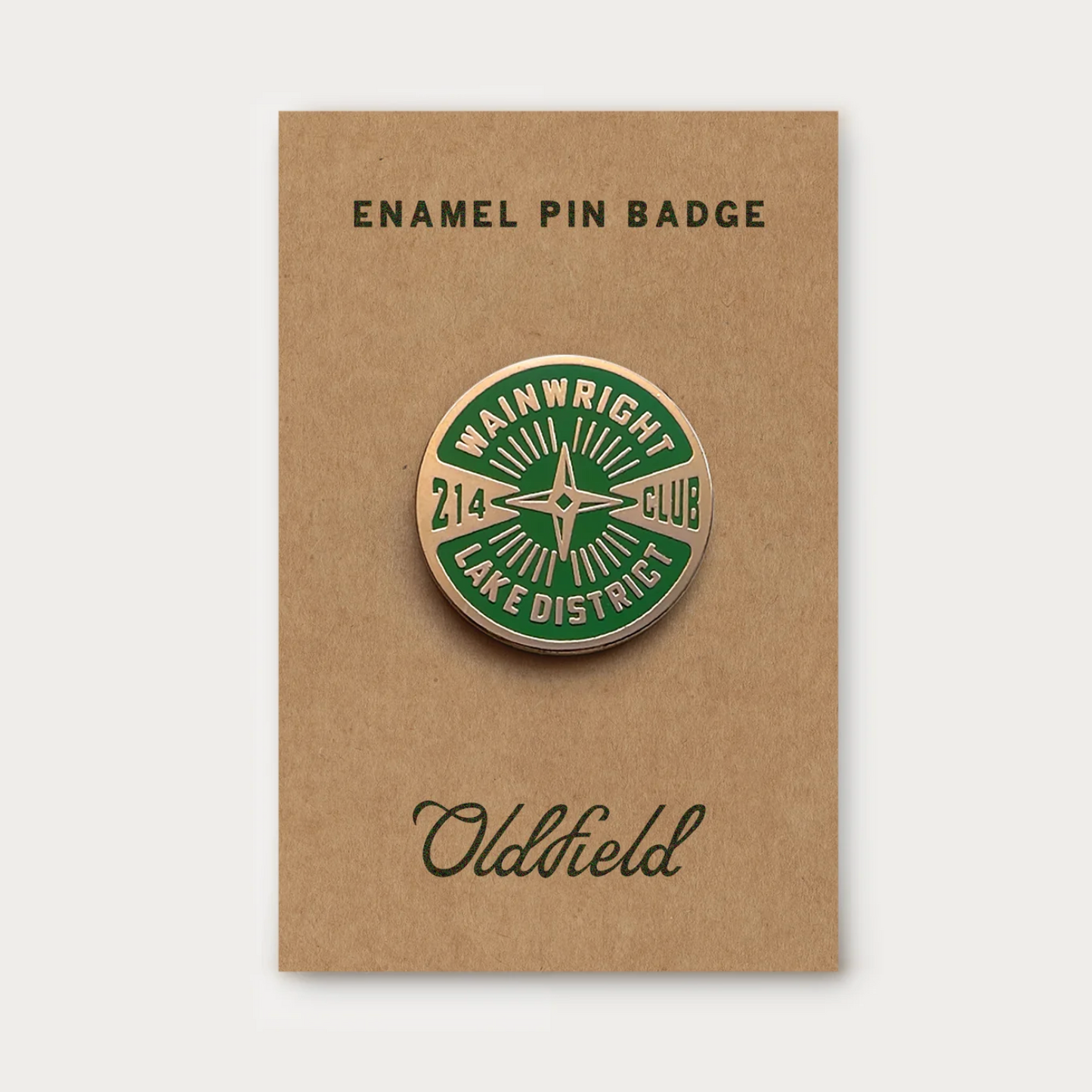 Enamel pin badge on a brown card with 'Oldfield' branding