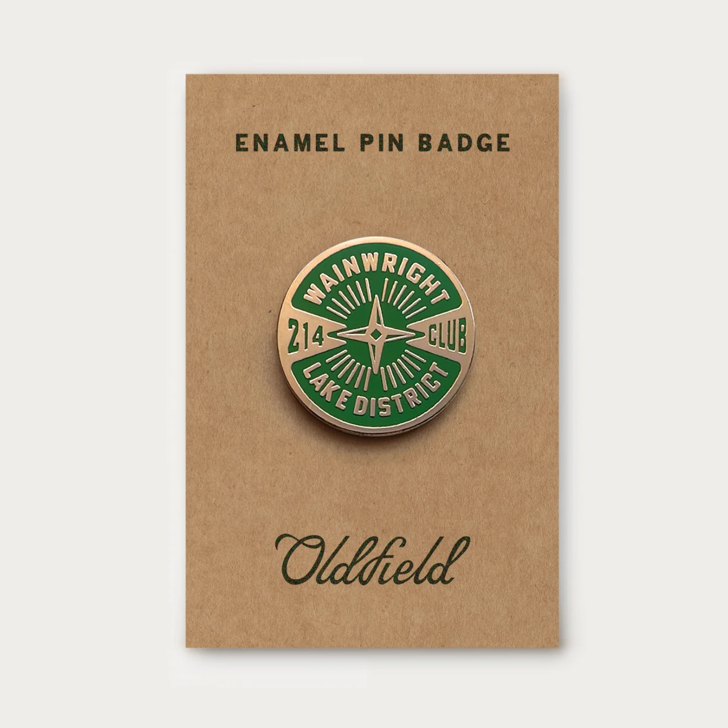 Enamel pin badge on a brown card with 'Oldfield' branding