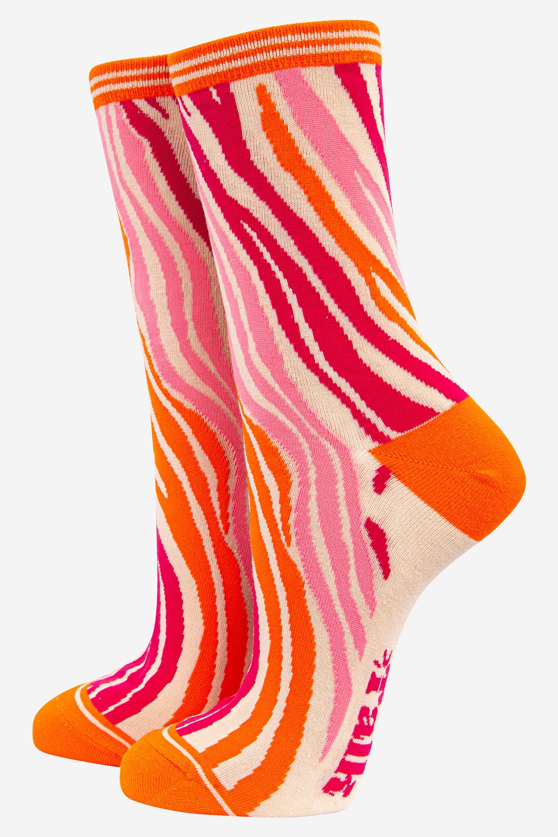 Colourful striped sock with pink, orange, and white zebra pattern