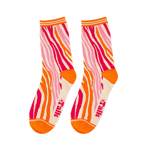 Pair of socks with pink and orange pattern on a white background